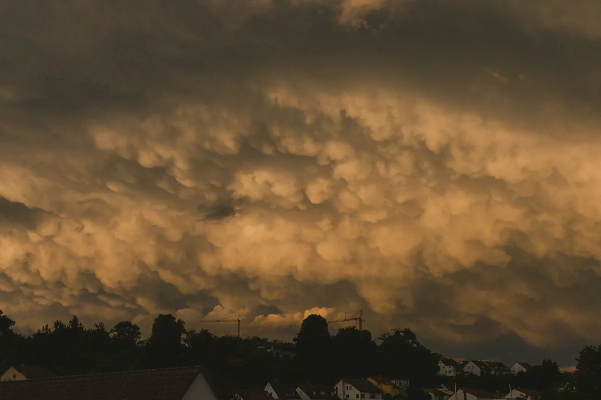 Storm clouds gathering over Sherman, TX homes before a severe storm